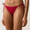 Slip bikini a copertura media con tessuto a nido d’ape e lacci Slip bikini a copertura media con tessuto a nido d’ape e lacci