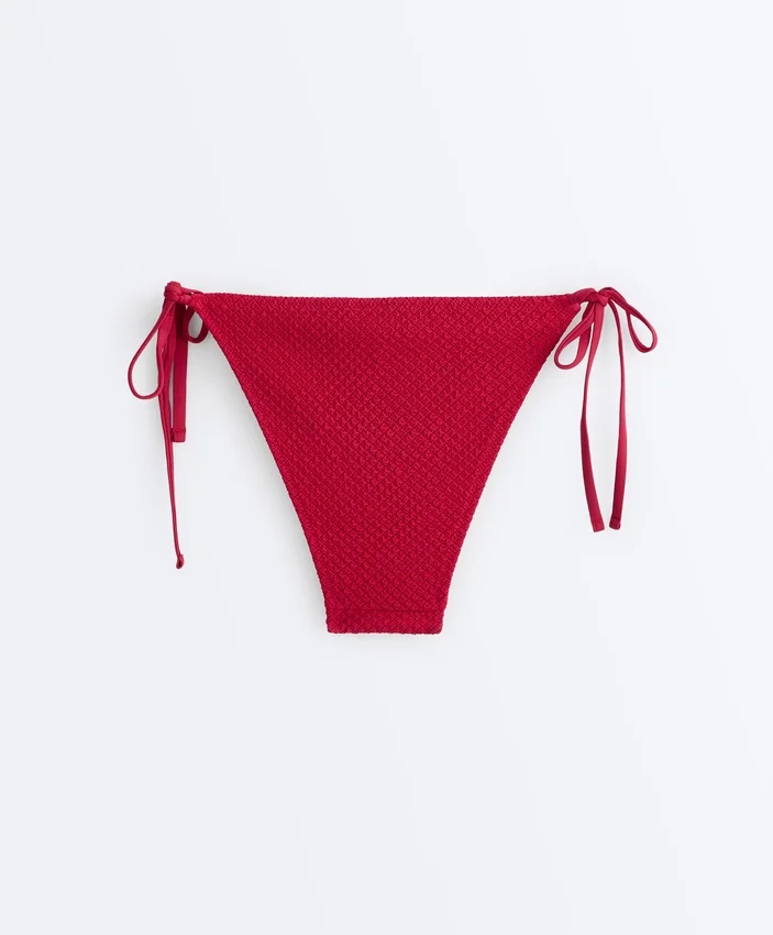 Slip bikini a copertura media con tessuto a nido d’ape e lacci Slip bikini a copertura media con tessuto a nido d’ape e lacci