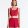 T-shirt corta in maglia lavata con spalline a trecce T-shirt corta in maglia lavata con spalline a trecce