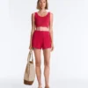 T-shirt corta in maglia lavata con spalline a trecce T-shirt corta in maglia lavata con spalline a trecce