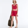 T-shirt corta in maglia lavata con spalline a trecce T-shirt corta in maglia lavata con spalline a trecce