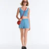 T-shirt corta in maglia lavata con spalline a trecce T-shirt corta in maglia lavata con spalline a trecce