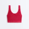 T-shirt corta in maglia lavata con spalline a trecce T-shirt corta in maglia lavata con spalline a trecce