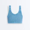T-shirt corta in maglia lavata con spalline a trecce T-shirt corta in maglia lavata con spalline a trecce