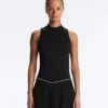 T-shirt senza maniche con mezza zip T-shirt senza maniche con mezza zip