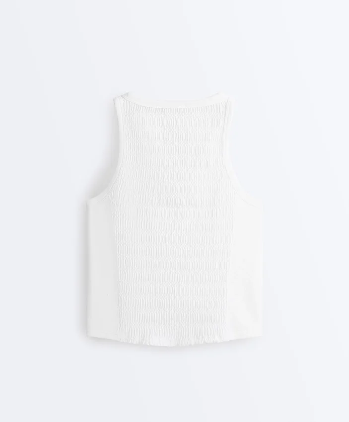 T-shirt senza maniche smockata senza cuciture T-shirt senza maniche smockata senza cuciture