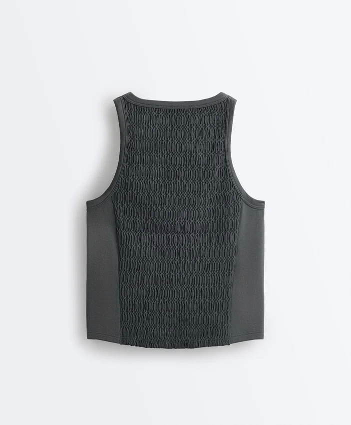 T-shirt senza maniche smockata senza cuciture T-shirt senza maniche smockata senza cuciture