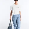 T-shirt squadrata in misto cotone con slogan T-shirt squadrata in misto cotone con slogan