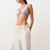 Slip bikini a copertura media a righe testurizzate con lacci