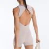 Tuta corta compressiva a contrasto in pantaloncini