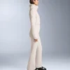 Tuta intera elasticizzata svasata 2 in 1, impermeabile e rimovibile Tuta intera elasticizzata svasata 2 in 1, impermeabile e rimovibile