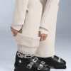 Tuta intera elasticizzata svasata 2 in 1, impermeabile e rimovibile Tuta intera elasticizzata svasata 2 in 1, impermeabile e rimovibile