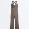 Tuta intera lunga svasata Comfortlux con scollo incrociato Tuta intera lunga svasata Comfortlux con scollo incrociato